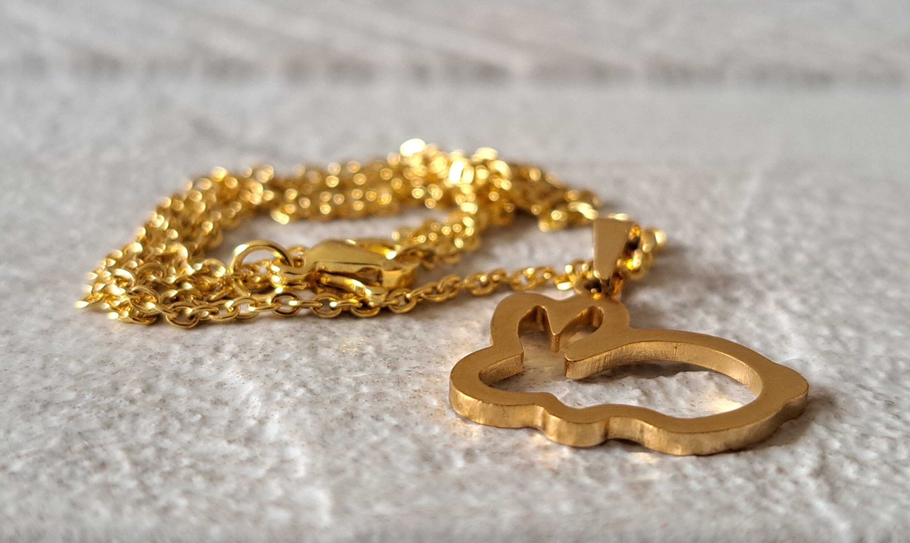 Gold Cut Out Rabbit Pendant and Necklace